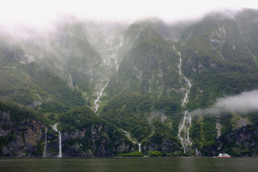 Milford Sound cruise boat and waterfalls
