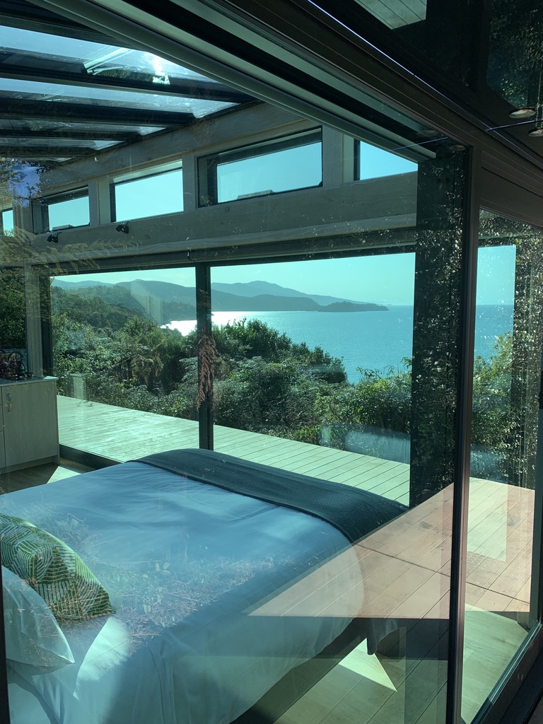 Glass view from bed in Purepod Stewart island
