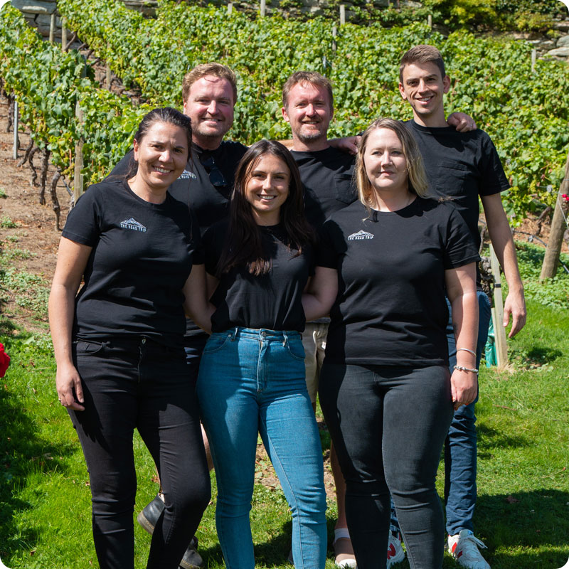 The Road Trip team standing together at a winery
