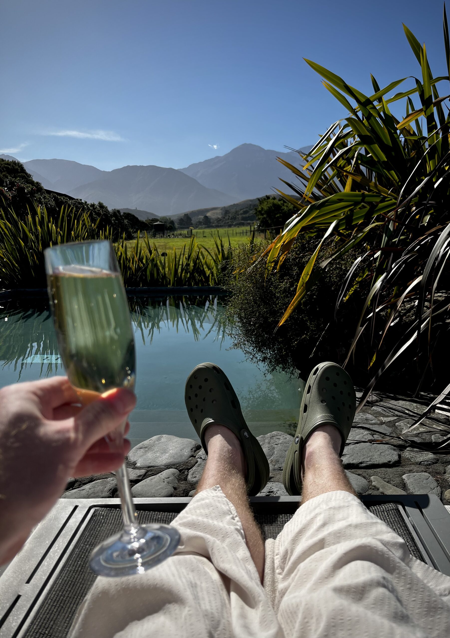 champagne by the pool and mountain views