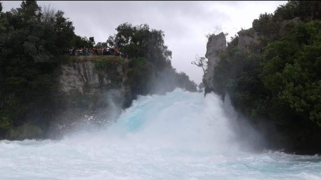 Huka Falls with a crowd nearby overlooking the waterfalls